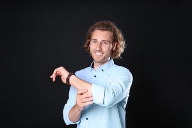 Portrait of handsome man on black background