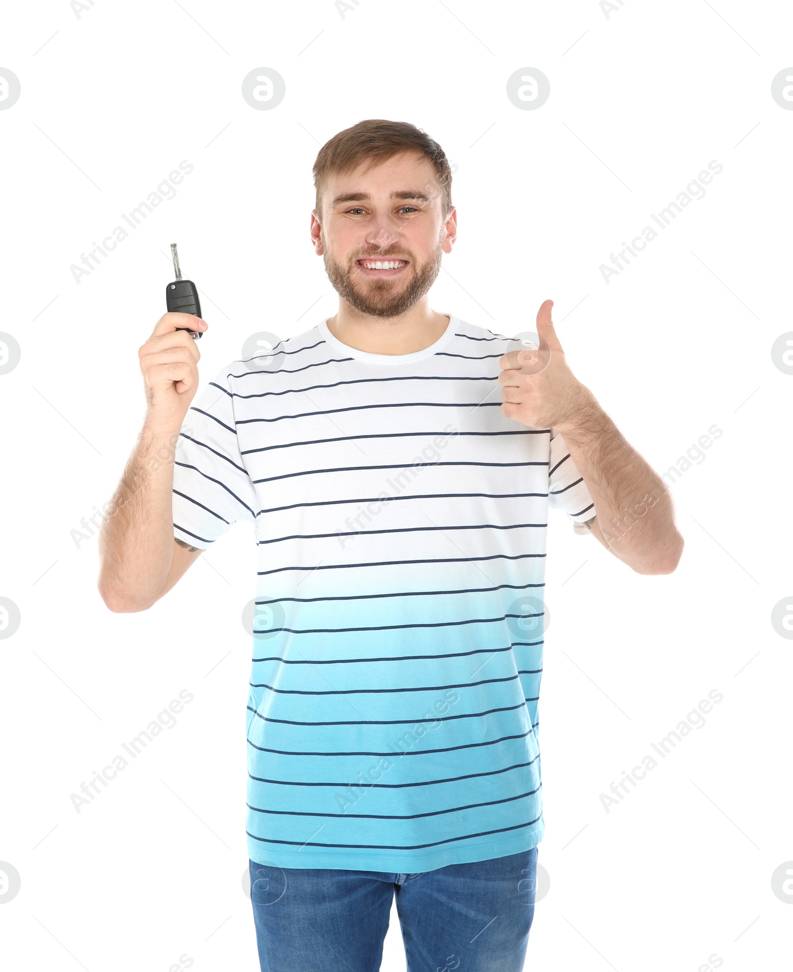 Photo of Happy young man with car key on white background. Getting driving license