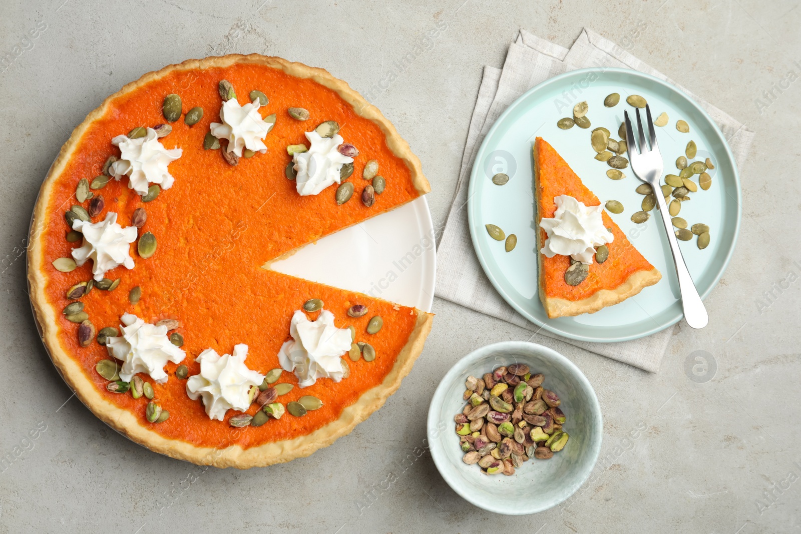 Photo of Delicious homemade pumpkin pie on light table, flat lay