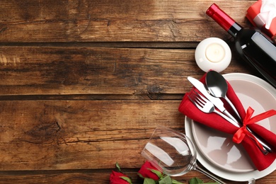 Photo of Beautiful table setting on wooden background, flat lay with space for text. Valentine's Day dinner