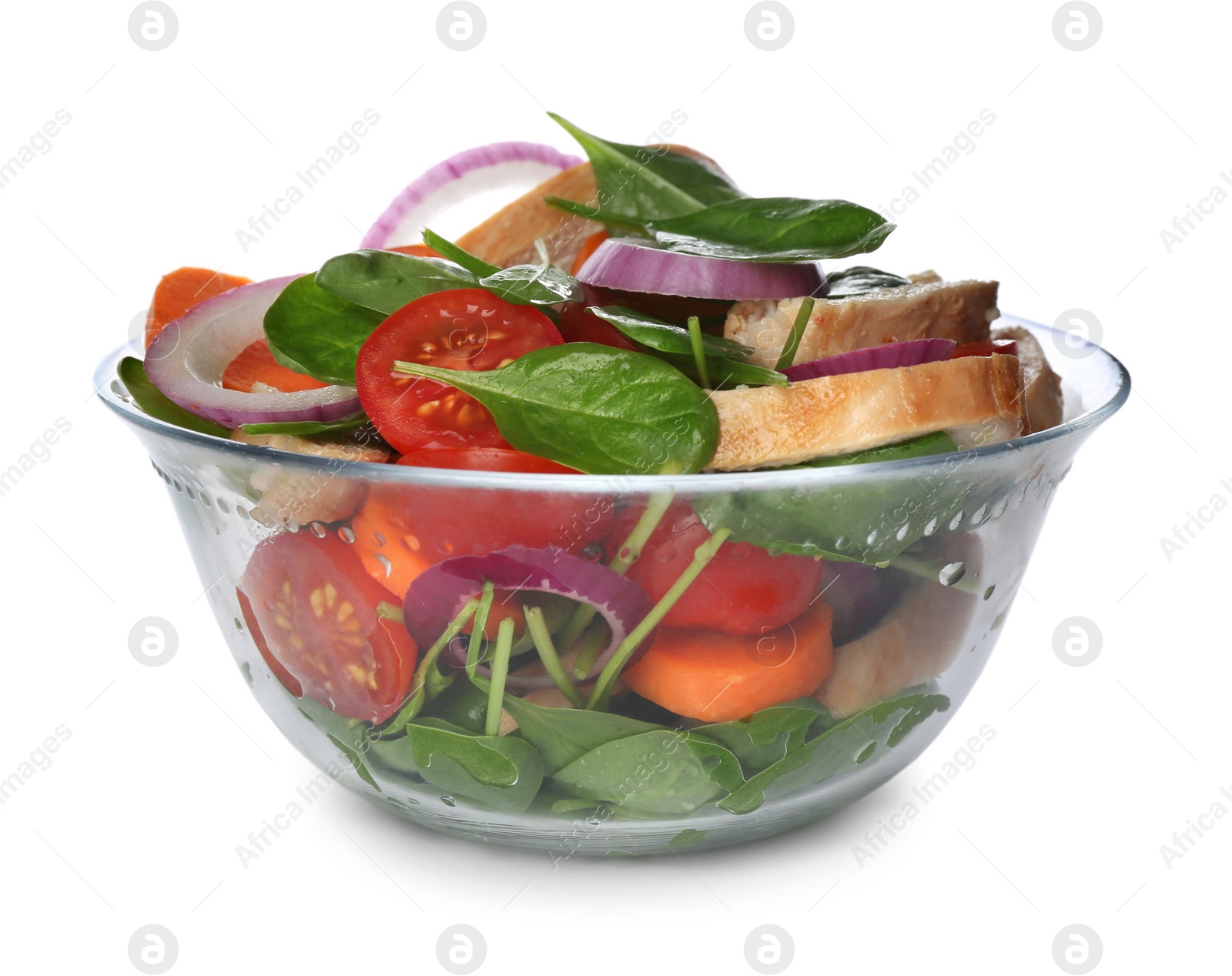 Photo of Delicious salad with chicken, vegetables and spinach in glass bowl isolated on white