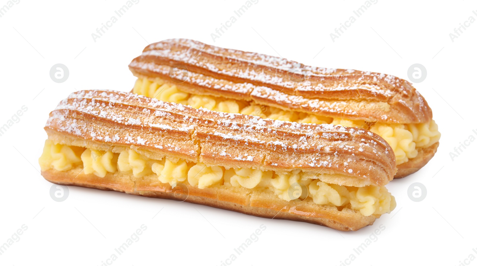 Photo of Delicious eclairs filled with cream isolated on white