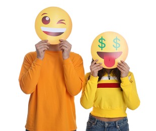Photo of People covering faces with emoticons on white background