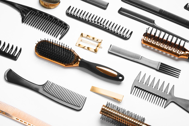 Photo of Composition with hair combs and brushes on white background, above view