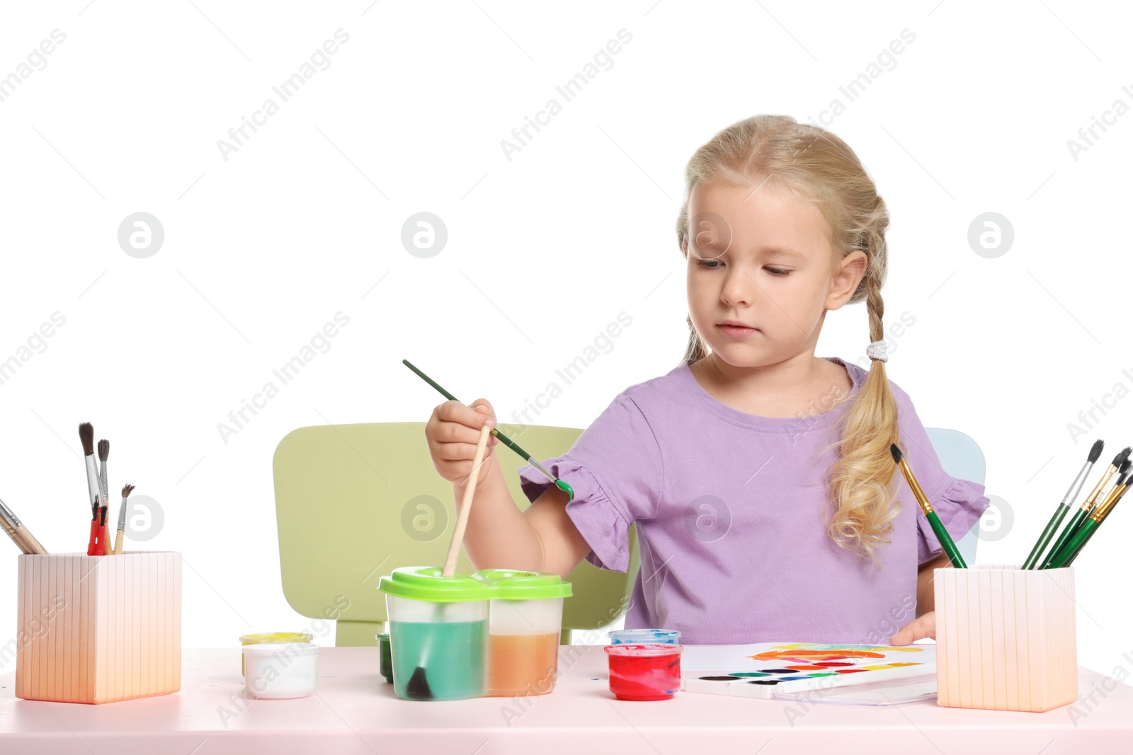 Photo of Cute child painting picture at table on white background