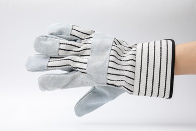 Photo of Woman in gardening glove on white background, closeup