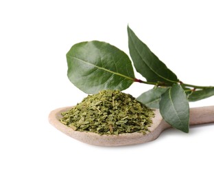 Photo of Spoon with ground and fresh bay leaves on white background
