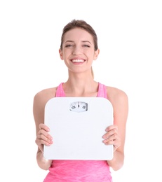Photo of Young beautiful woman with scales on white background. Weight loss motivation