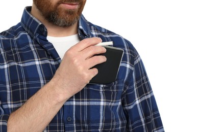 Man putting cigarette case into pocket isolated on white, closeup