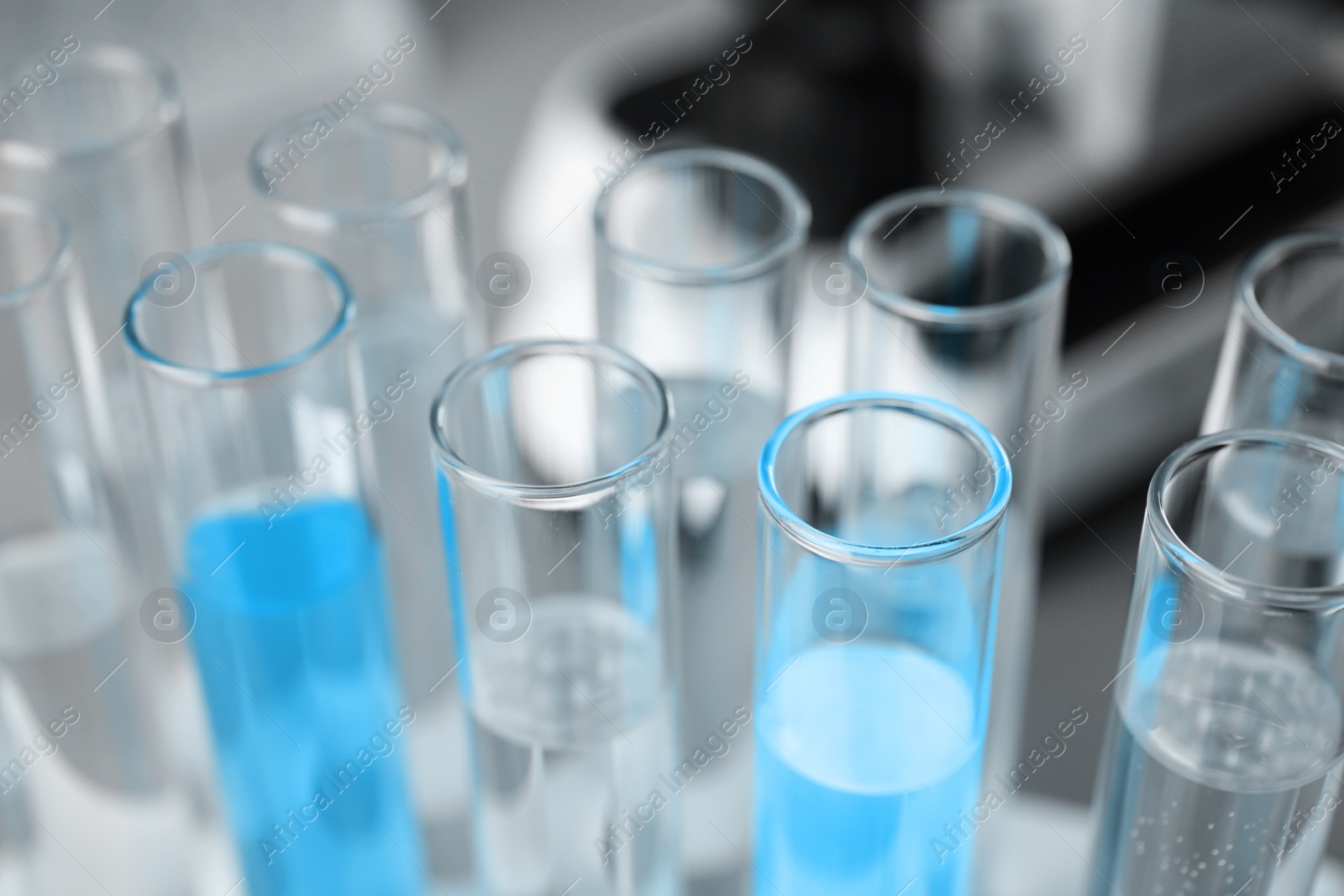 Image of Test tubes with different samples, closeup. Laboratory glassware