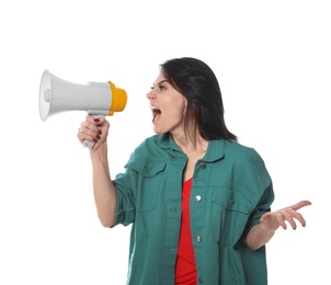 Portrait of emotional woman using megaphone on white background