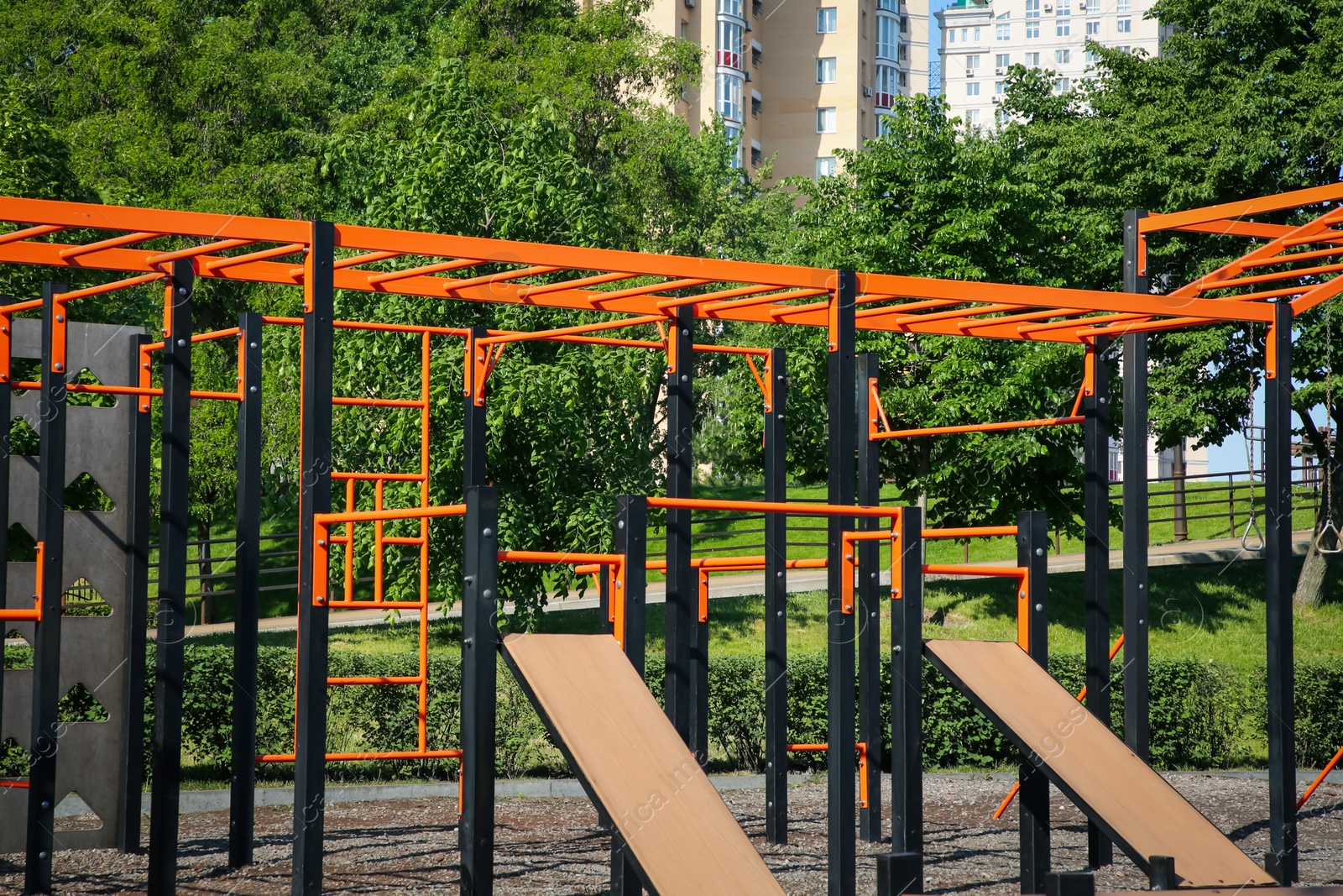 Photo of Empty outdoor gym with exercise equipment in park