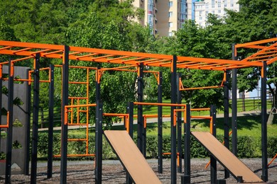 Photo of Empty outdoor gym with exercise equipment in park