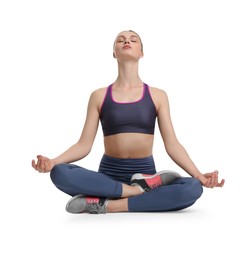 Photo of Young woman practicing yoga on white background