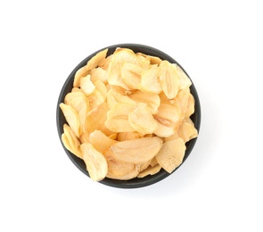 Dried garlic flakes in bowl on white background, top view