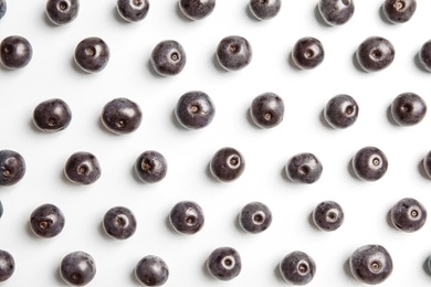 Photo of Fresh acai berries on white background