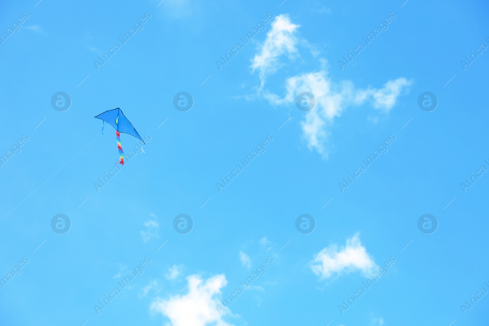 Photo of Beautiful kite drifting in blue sky