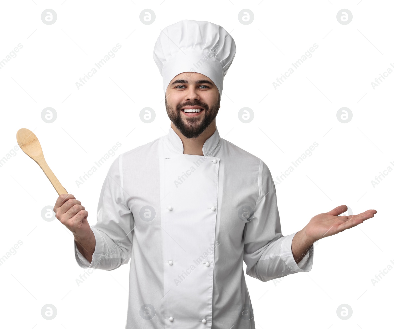 Photo of Happy young chef in uniform holding wooden spoon on white background