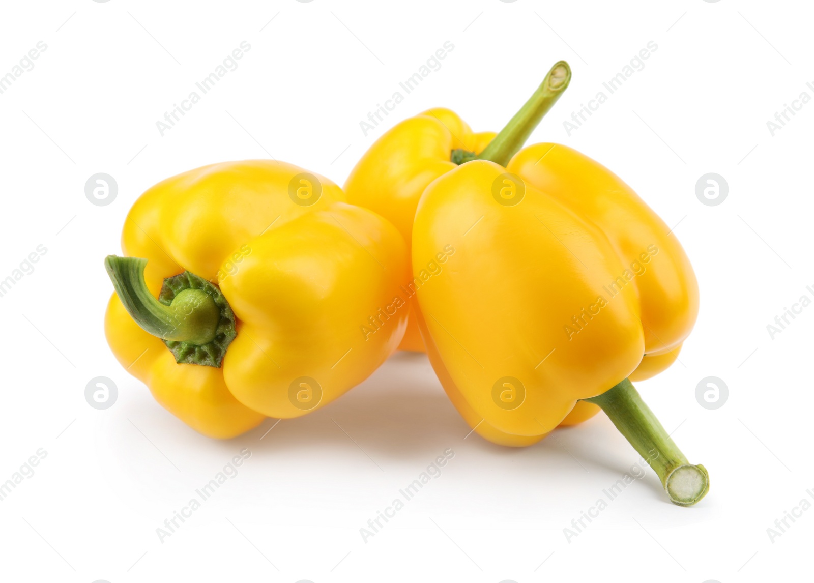 Photo of Ripe yellow bell peppers isolated on white