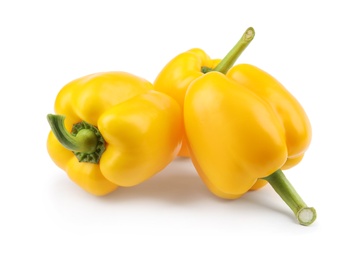 Ripe yellow bell peppers isolated on white