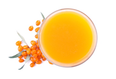 Photo of Delicious sea buckthorn juice and fresh berries isolated on white, top view