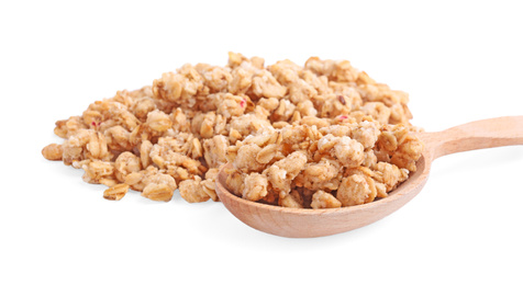 Tasty crispy granola and wooden spoon on white background