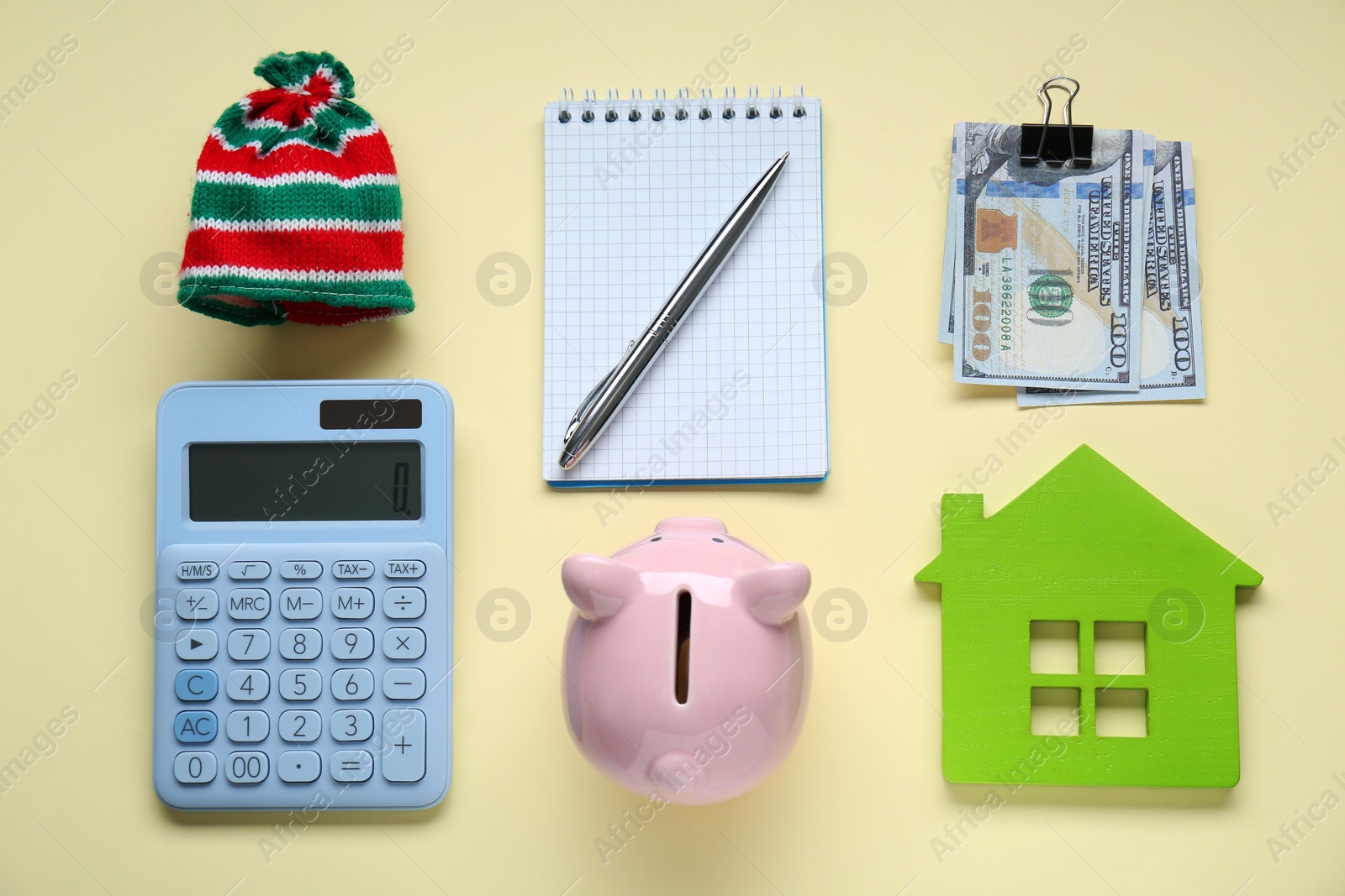 Photo of Flat lay composition with piggy bank and calculator on beige background