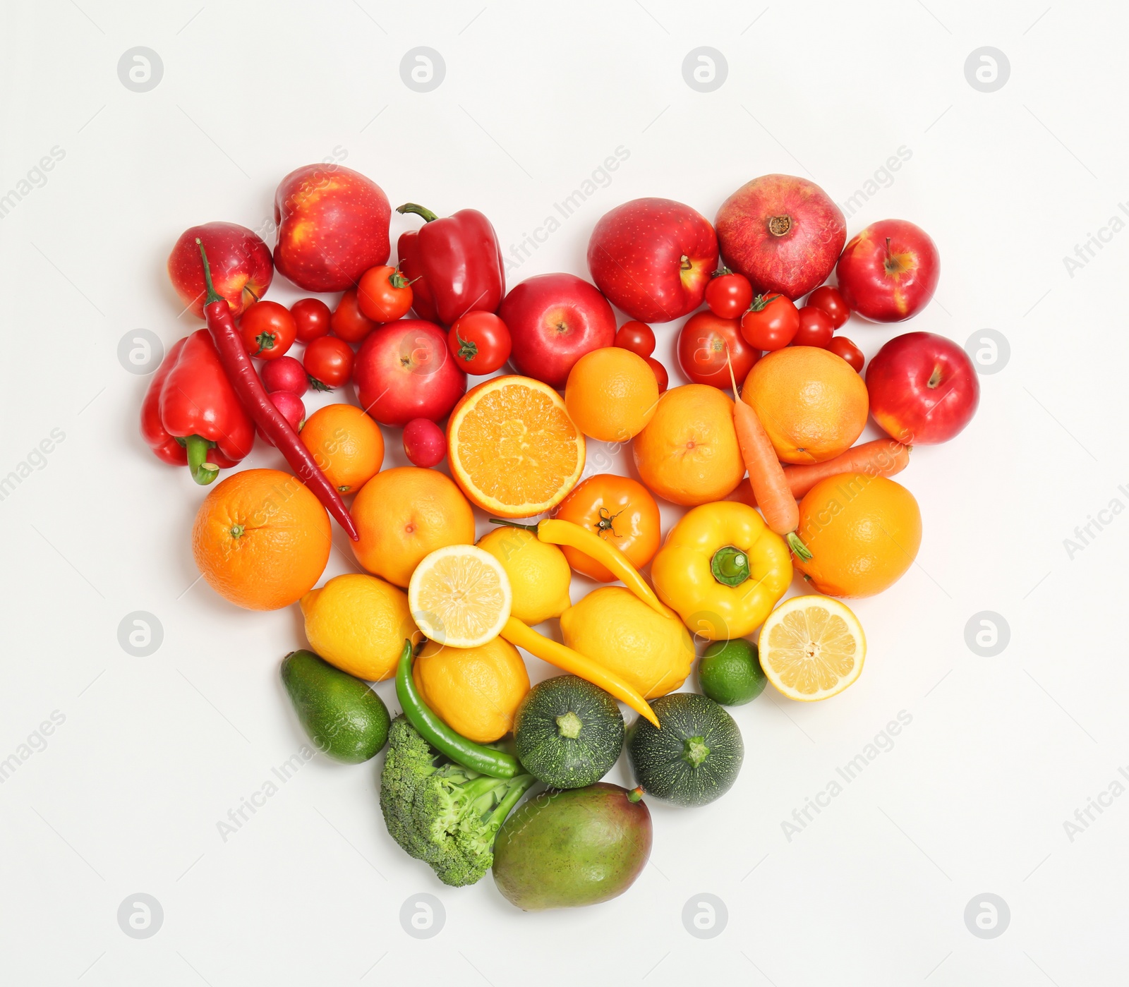 Photo of Heart made of ripe fruits and vegetables in rainbow colors on light background, top view