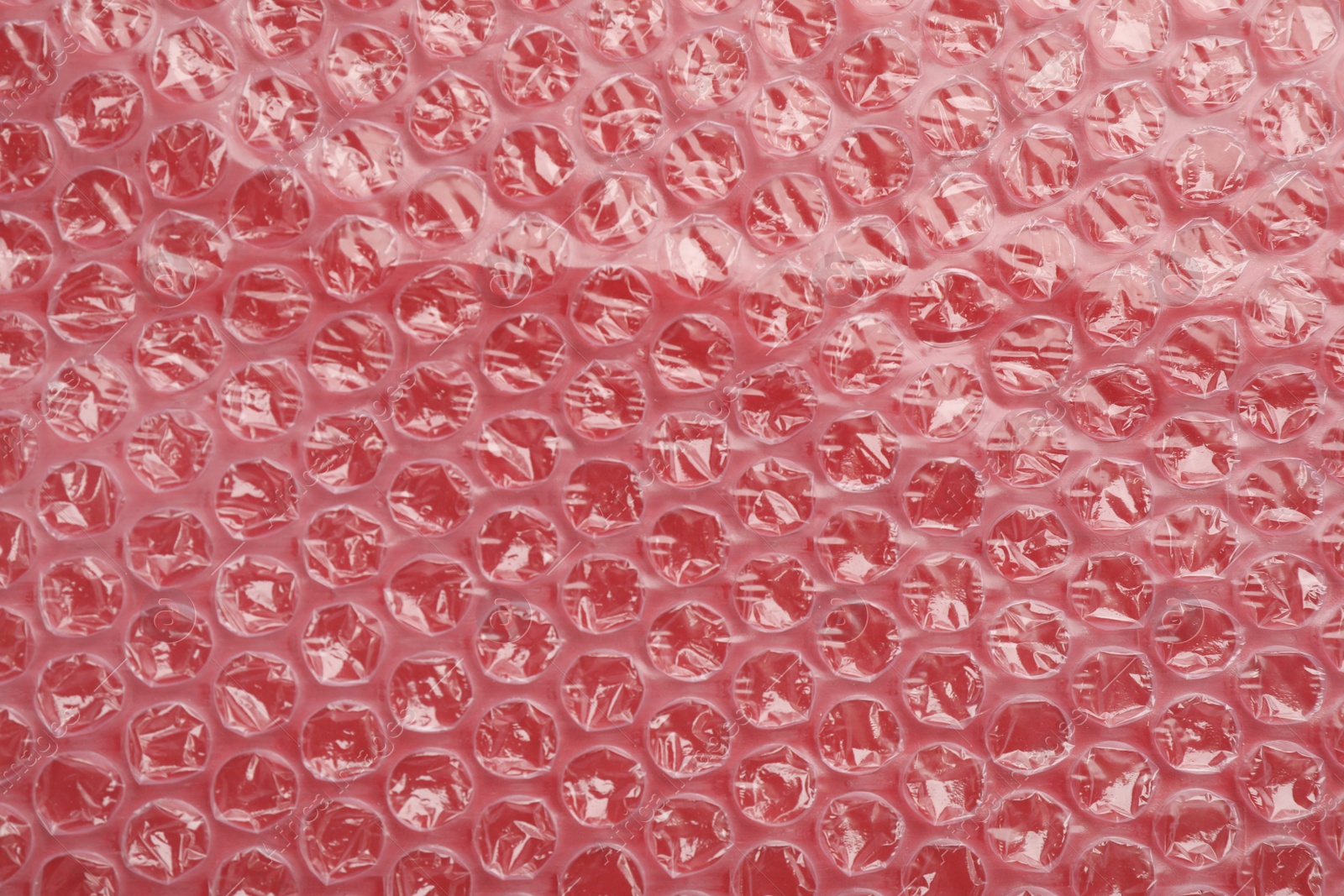 Photo of Texture of bubble wrap as background, top view