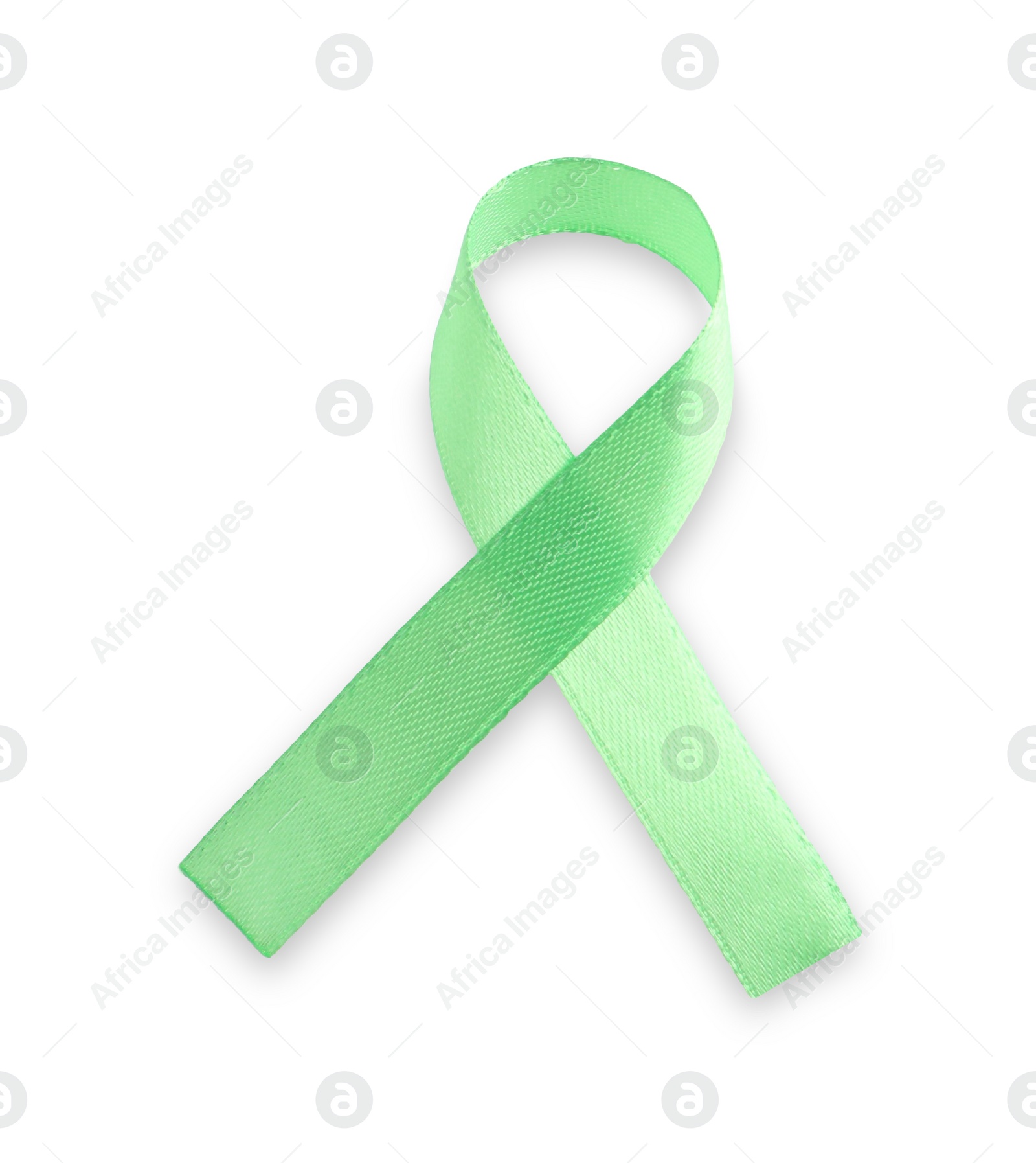 Photo of Light green awareness ribbon isolated on white, top view