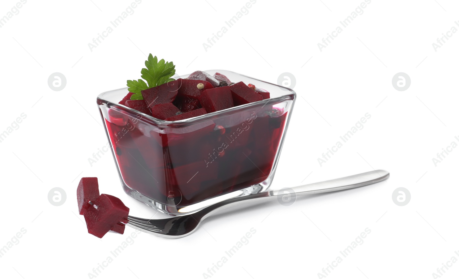 Photo of Pickled beets with parsley in glass bowl and fork isolated on white