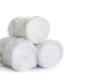 Photo of Rolls of fluffy cotton on white background