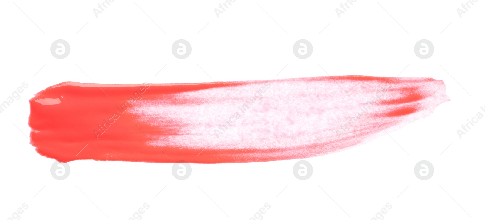 Photo of Abstract brushstroke of red paint isolated on white
