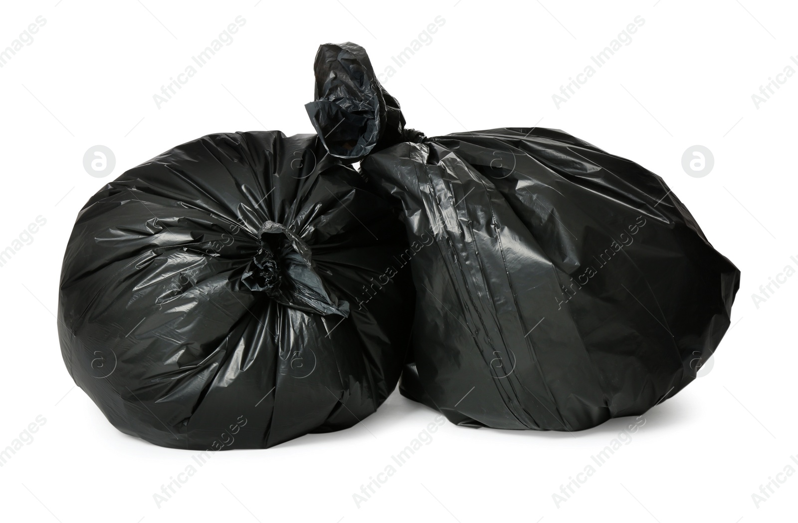 Photo of Trash bags full of garbage isolated on white