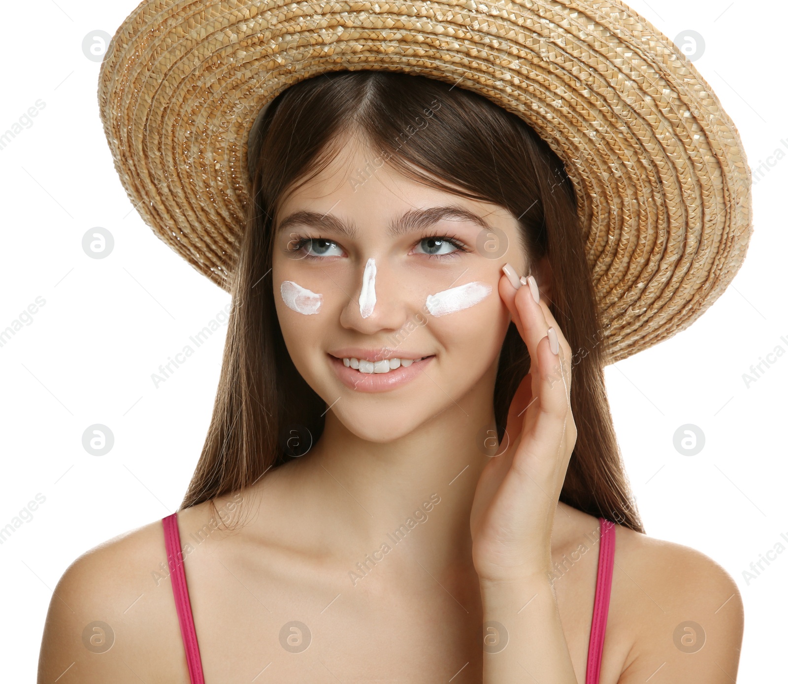 Photo of Teenage girl with sun protection cream on her face against white background