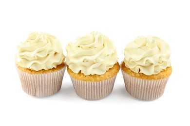 Photo of Tasty vanilla cupcakes with cream isolated on white