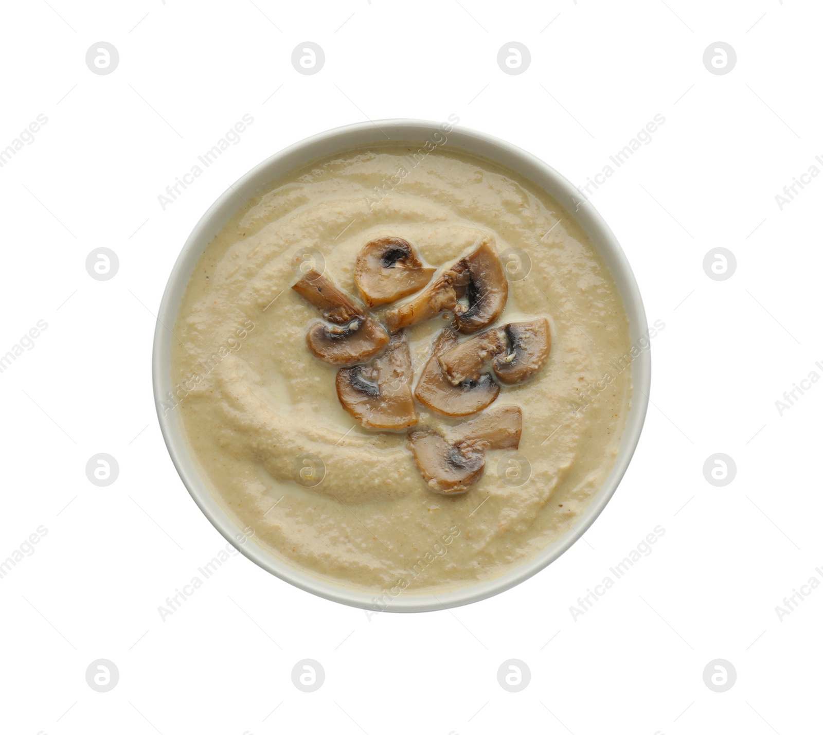 Photo of Delicious mushroom cream soup isolated on white, top view