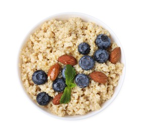 Photo of Bowl of delicious cooked quinoa with almonds and blueberries isolated on white, top view