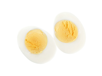 Photo of Halves of fresh hard boiled chicken egg isolated on white, top view