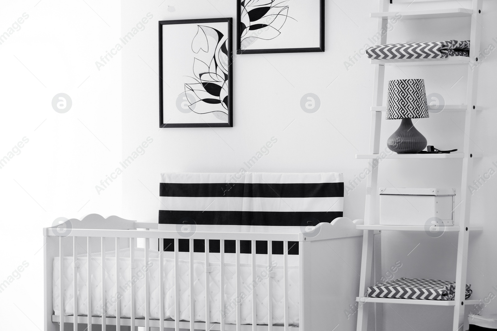 Photo of Baby bedroom interior with crib and beautiful decor elements