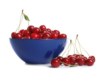 Photo of Blue ceramic bowl of delicious ripe sweet cherries on white background