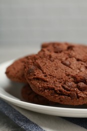 Delicious chocolate chip cookies on plate, closeup