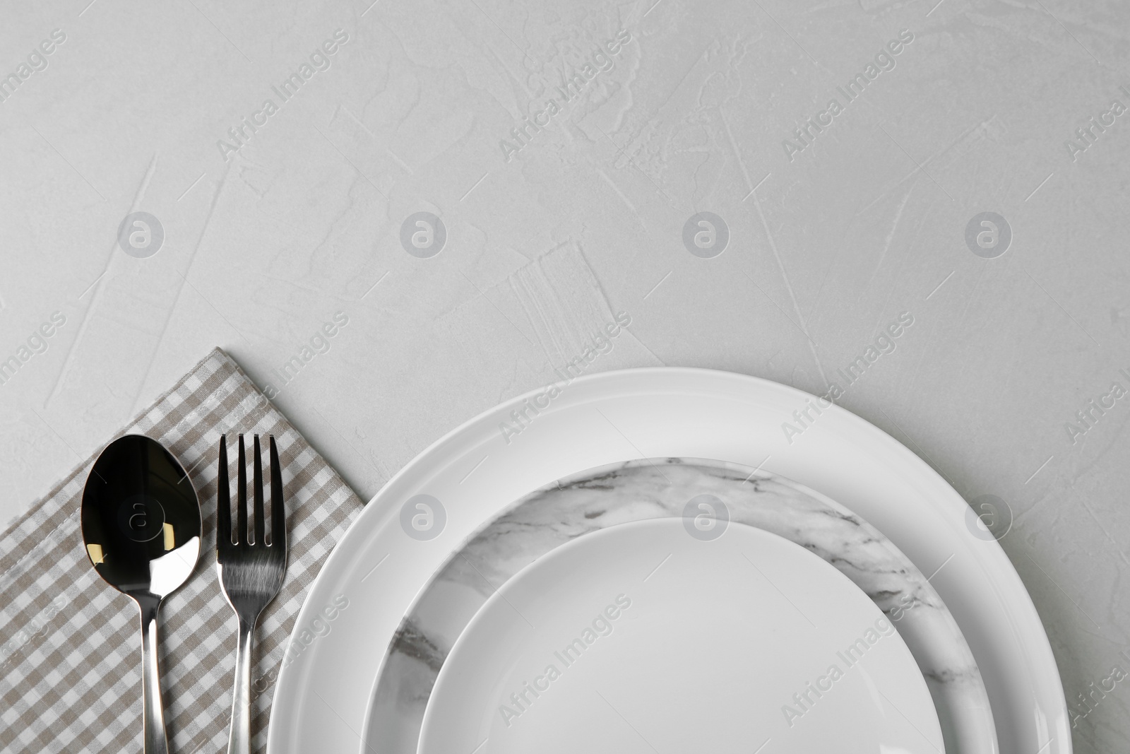 Photo of Beautiful table setting on grey background, flat lay. Space for text