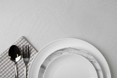 Beautiful table setting on grey background, flat lay. Space for text