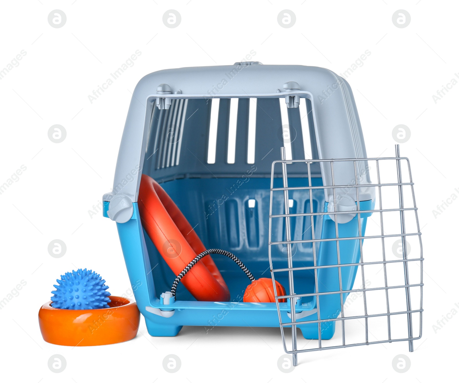 Photo of Light blue pet carrier with toys and bowl isolated on white