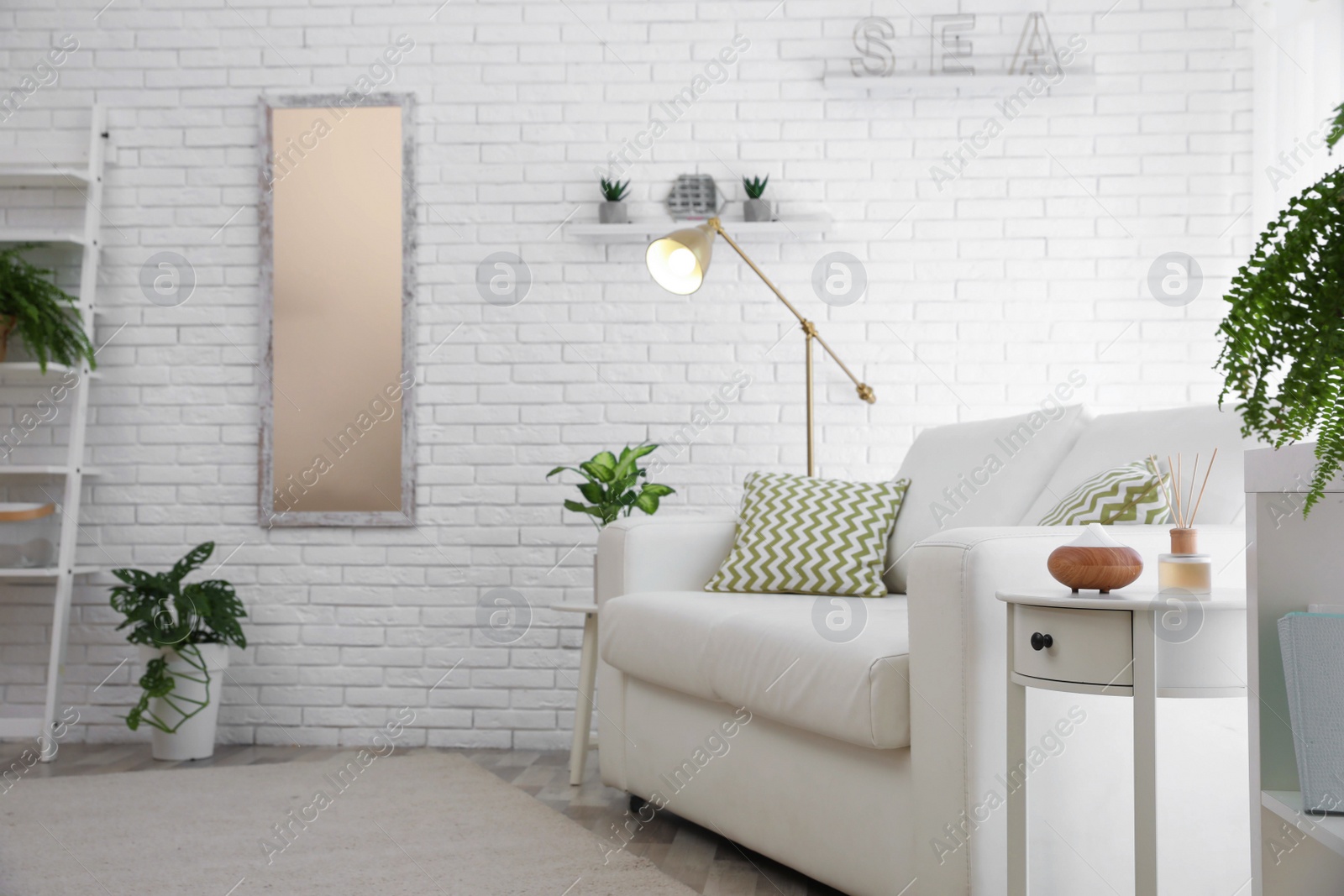 Photo of Stylish room interior with green home plants