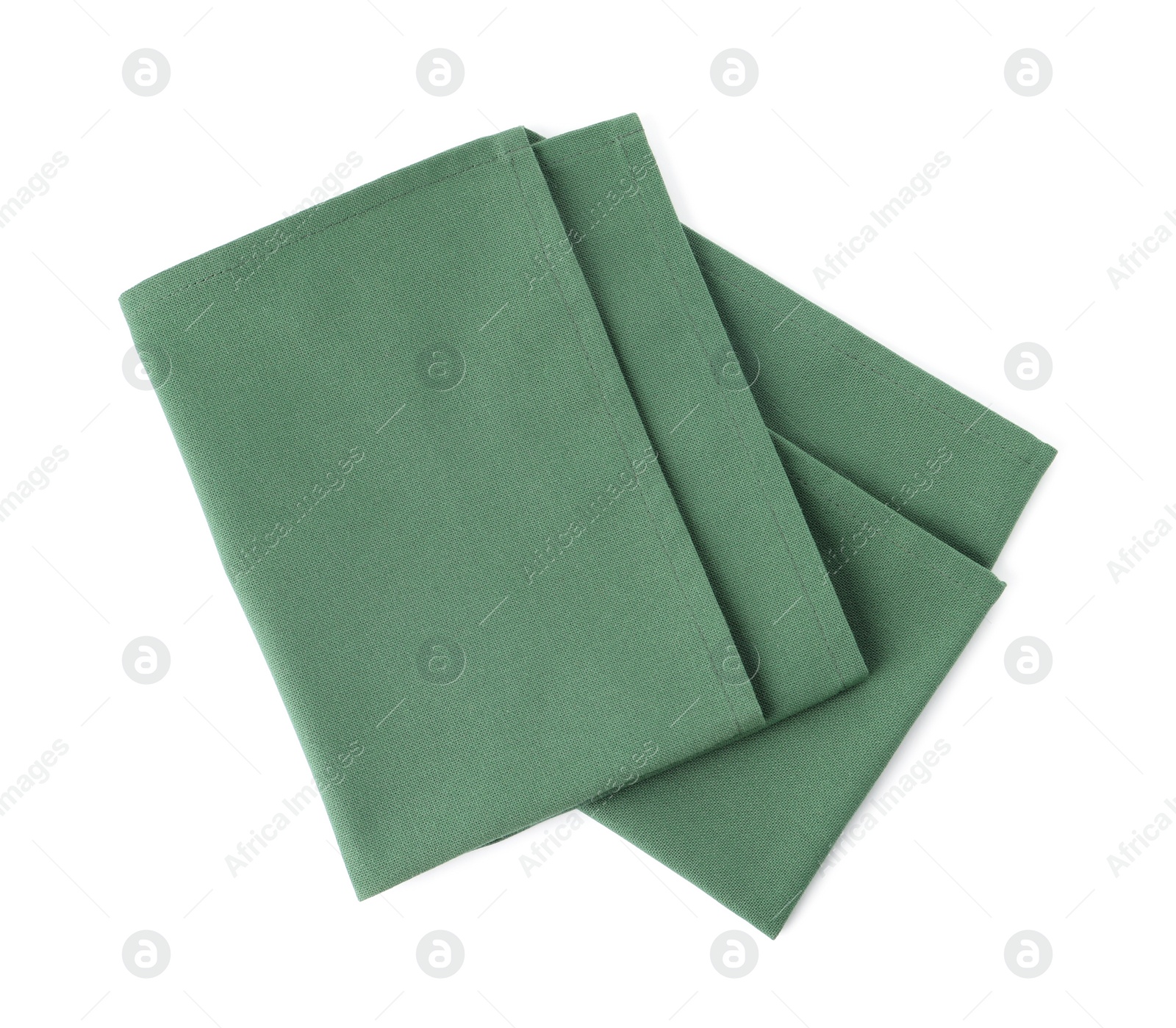 Photo of New clean green cloth napkins isolated on white, top view