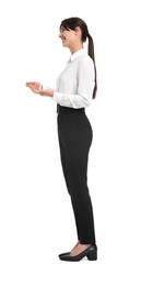 Happy businesswoman in shirt and black pants on white background