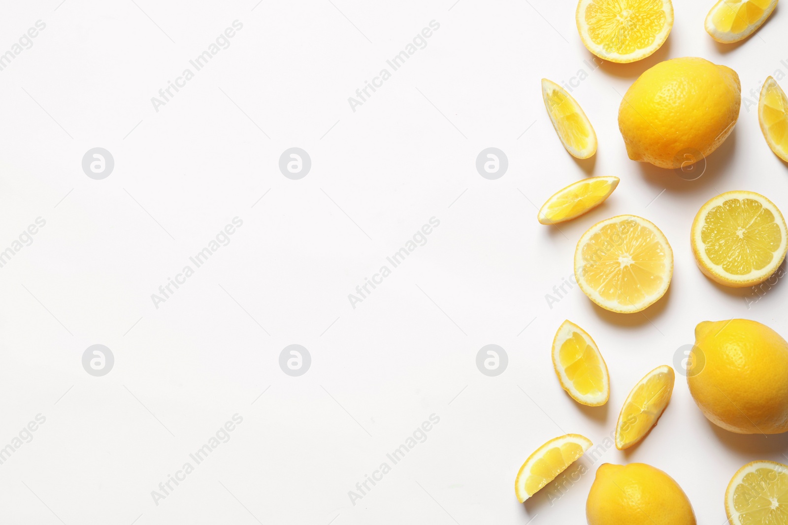 Photo of Fresh lemons on white background, top view. Citrus fruits