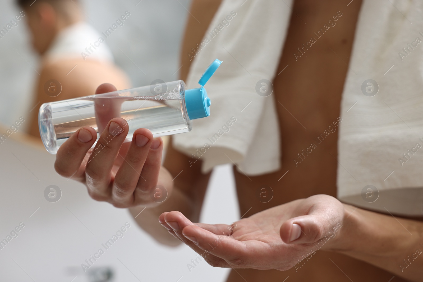 Photo of Man with lotion in bathroom, closeup view